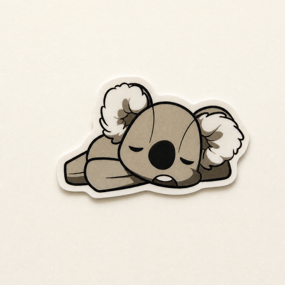 Koko the Koala collectible sticker on a warm off-white background